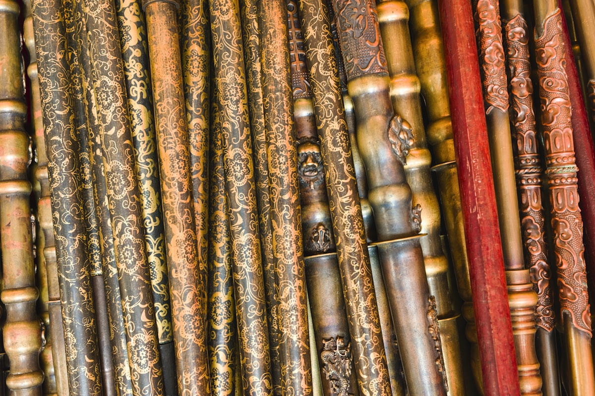 Various wooden flutes displayed at a market in an Asian city during the daytime - Wooden flutes of different shapes and sizes lie side by side at a market. The market is busy with visitors exploring musical instruments and local crafts during the day. related to Brass Beds for Sale: Timeless Elegance for Your Bedroom