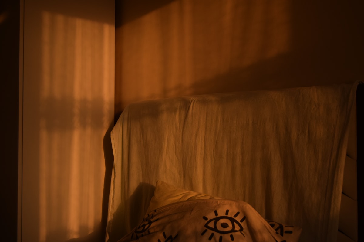 Warm sunlight casts striped shadows on a wall related to Transform Your Bedroom with a Sun and Moon Bed Set