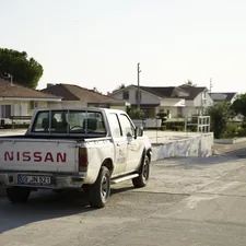 white and black chevrolet crew cab pickup truck parked on gray concrete road during daytime related to Maximizing Utility: The Best Nissan Frontier Bed Racks for Adventure and Work