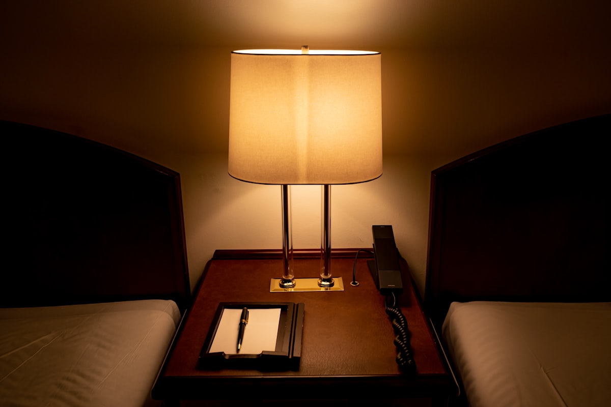 white and black table lamp related to Illuminate Your Nighttime Reads: The Best Reading Light for Bed