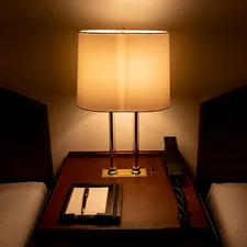 white and black table lamp related to Illuminate Your Nighttime Reads: The Best Reading Light for Bed