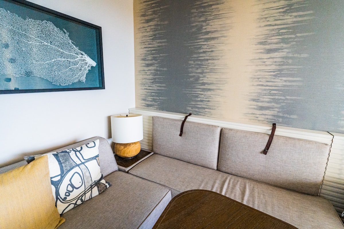 white and black throw pillow on gray couch related to Elevate Your Space: The Innovative Pull Out Bed Sectional