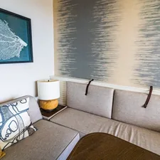 white and black throw pillow on gray couch related to Elevate Your Space: The Innovative Pull Out Bed Sectional