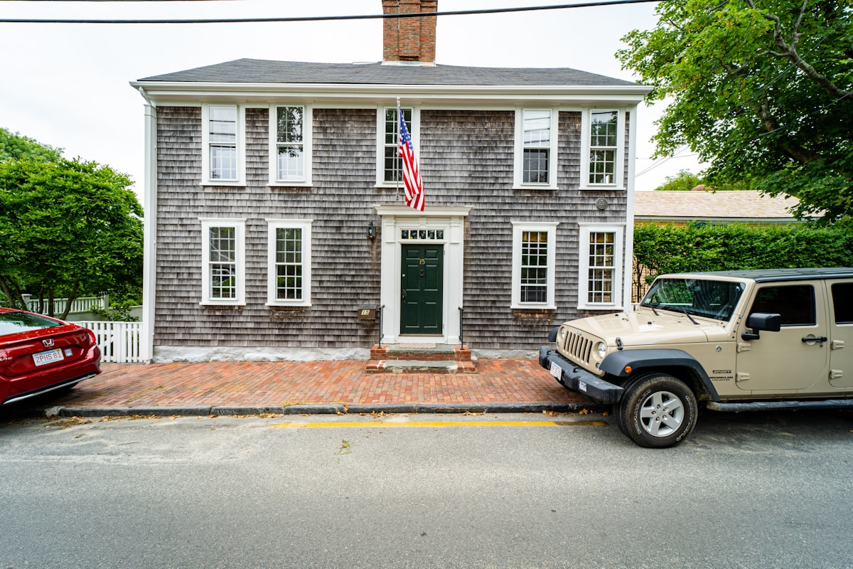 white and brown concrete house related to Discover the Charm of Nantucket: Your Ultimate Bed and Breakfast Guide