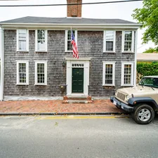 white and brown concrete house related to Discover the Charm of Nantucket: Your Ultimate Bed and Breakfast Guide