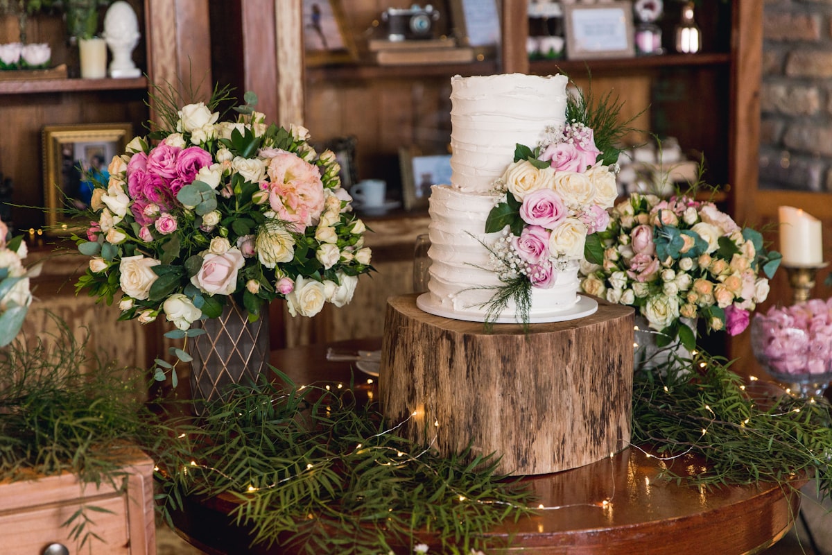 white and pink flowers on brown wooden round table related to Bring Rustic Charm to Your Home: Mastering the Art of Country Style Curtains and Valances
