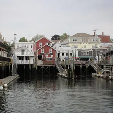 white and red houses beside river during daytime related to Discover the Charm of Portland Maine Bed and Breakfast