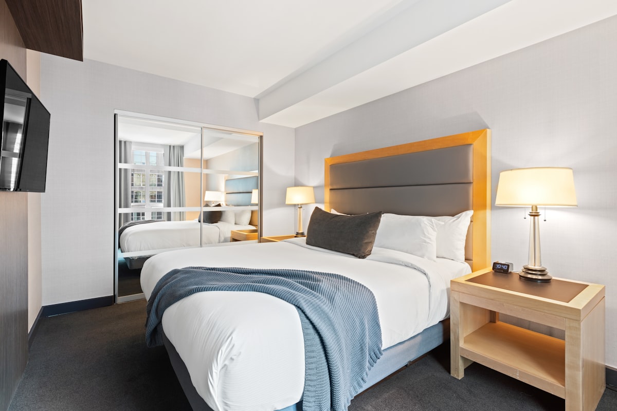 white bed linen on bed related to The Classic Comfort: Unveiling the Standard Queen Size Bed