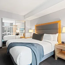 white bed linen on bed related to The Classic Comfort: Unveiling the Standard Queen Size Bed