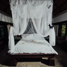 white bed linen on bed related to The Ultimate Guide to Canopy Bed Frames