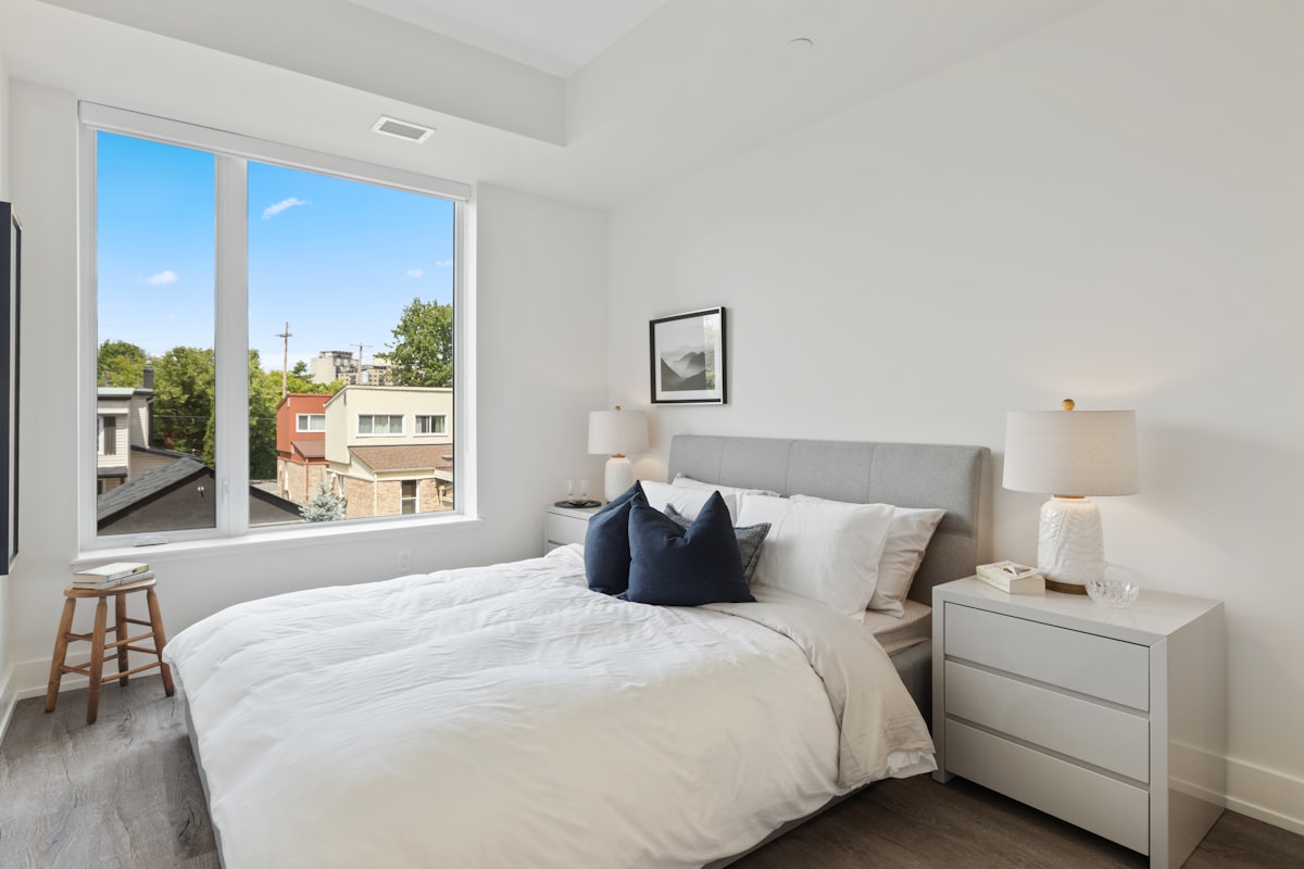 white bed linen with blue throw pillows related to The Ultimate Guide to Finding Your Dream Platform Queen Bed