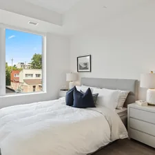 white bed linen with blue throw pillows related to The Ultimate Guide to Finding Your Dream Platform Queen Bed