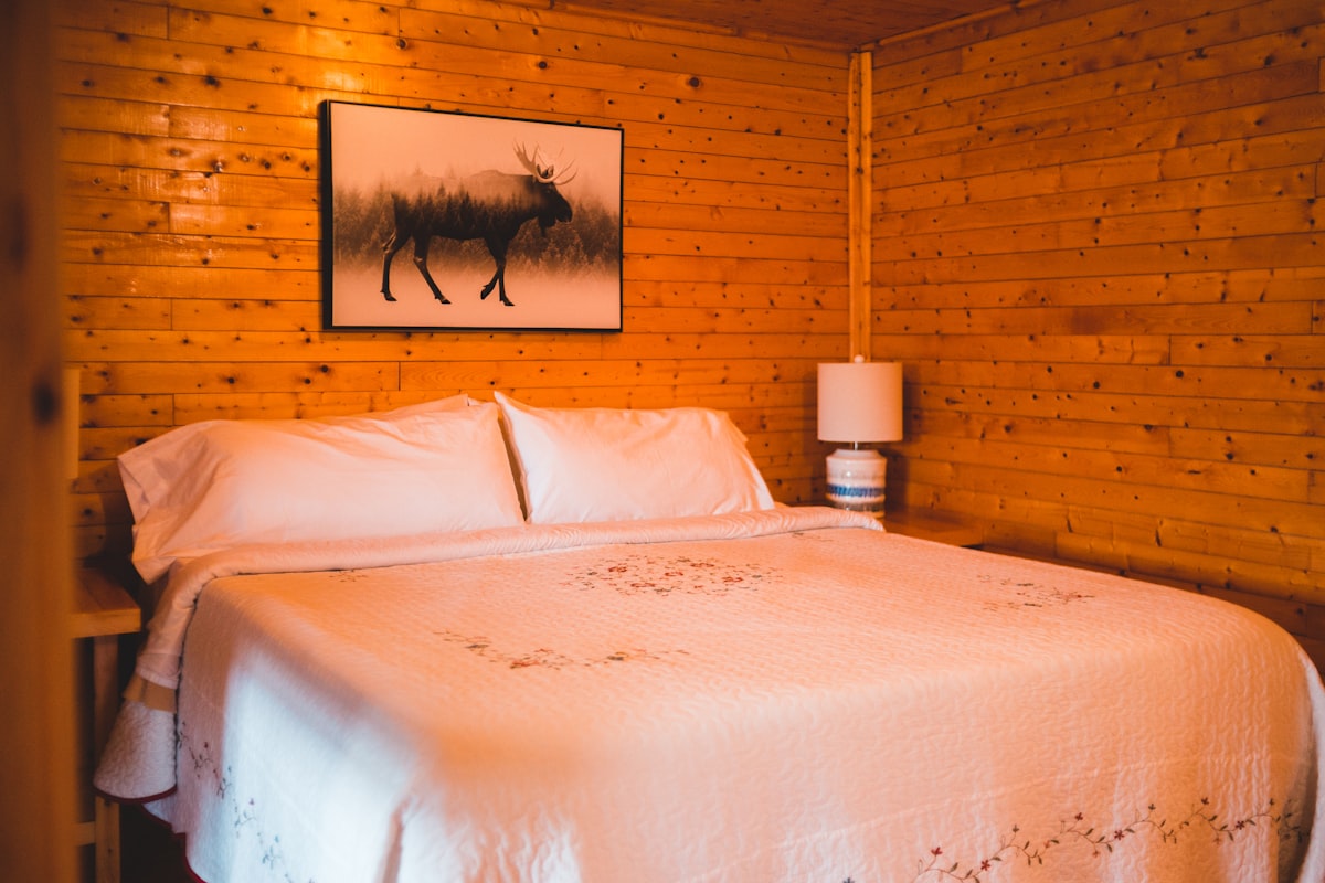 white bed linen with white table lamp related to Great Wolf Lodge Bed Bug Concerns:  What You Need to Know