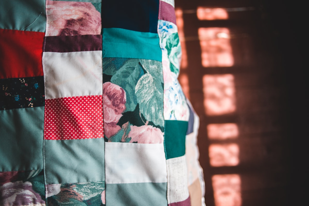 white blue and red textile related to Understanding the Difference: Quilt vs Coverlet