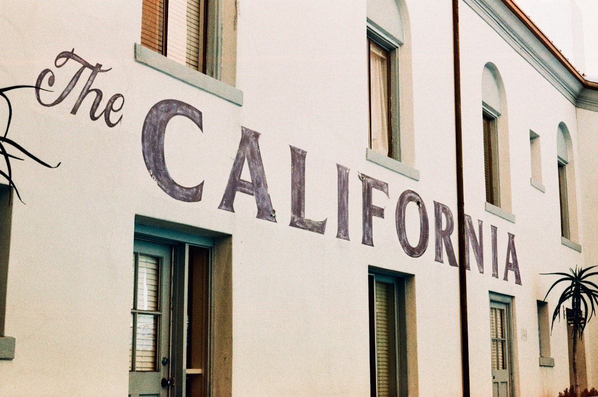 White building with "the california" painted on its side. related to Exploring the Dimensions of a California King Size Bed