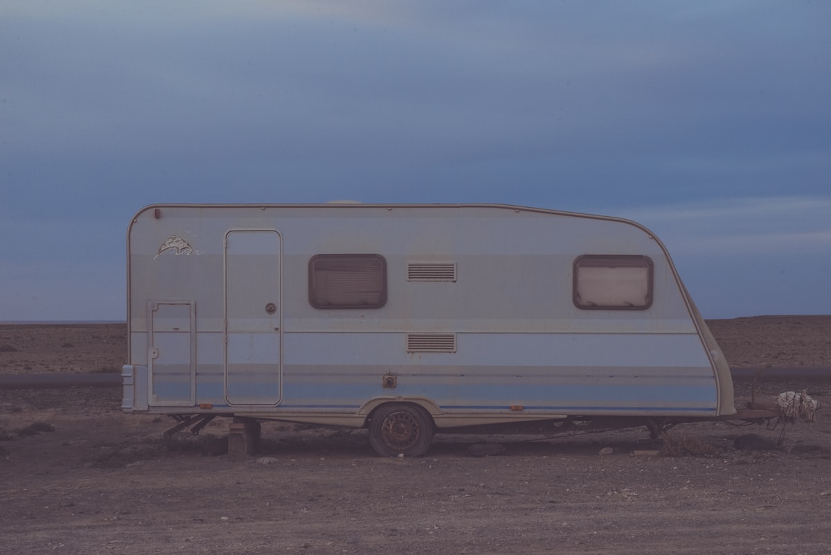 white camper trailer on desert related to Exploring the Best Travel Trailers with Bunk Beds