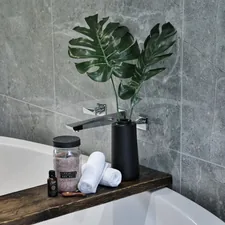 white ceramic bathtub with soap bottles related to Elevate Your Bath: The Perfect Guide to Valance Shower Curtain Sets