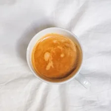 white ceramic mug with brown liquid related to The Ultimate Guide to Bed Bath and Beyond Espresso Machines