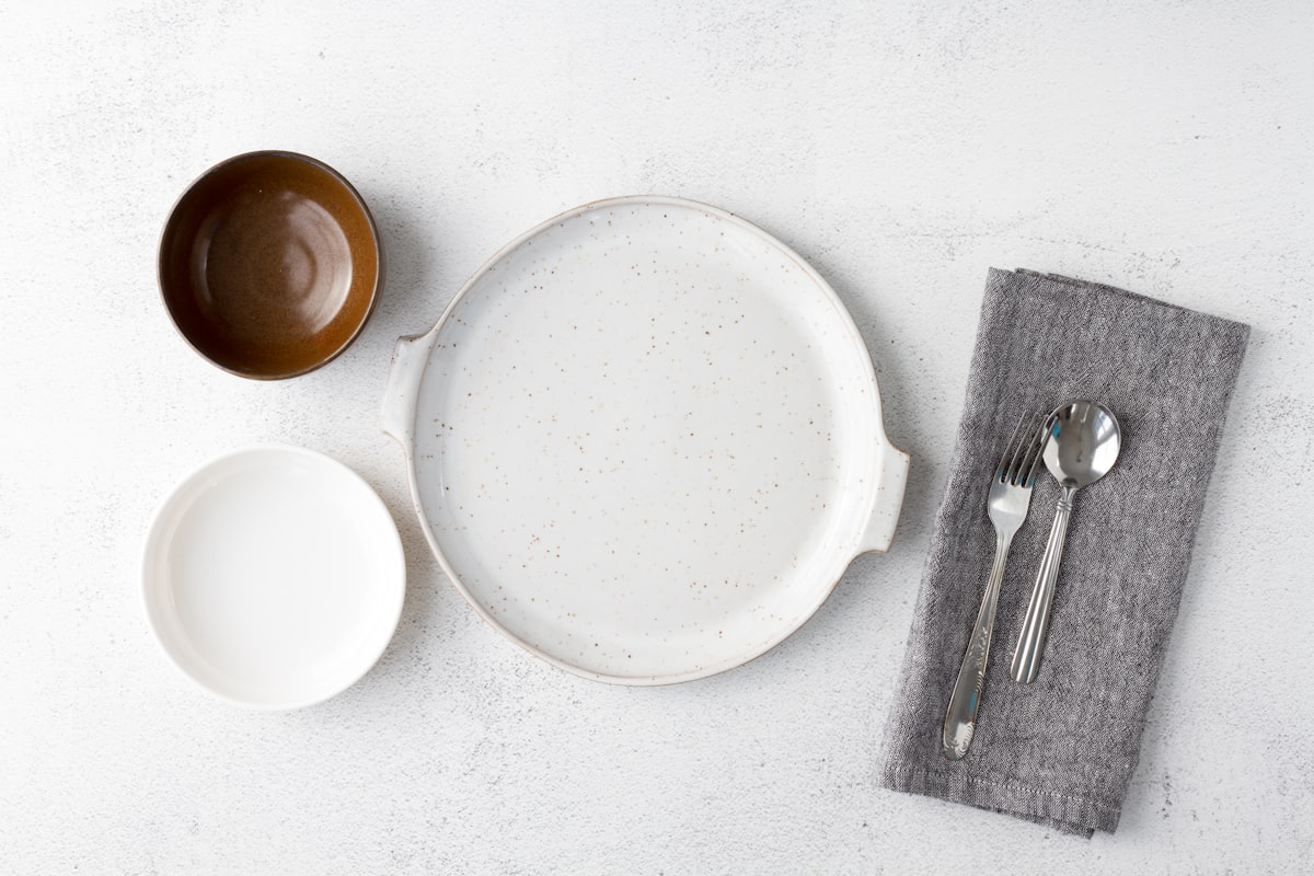 white ceramic plate beside stainless steel fork and bread knife related to Bed Bath & Beyond Dinnerware: Setting the Table for Every Occasion