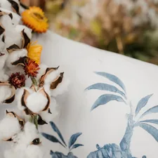 white flowers on white textile related to Snuggle in Luxury with Majestic Elephant Bedding