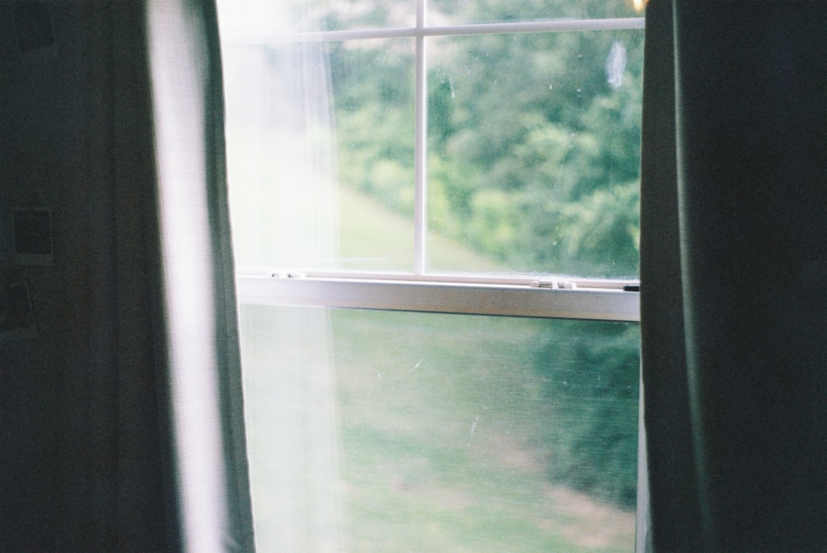 white framed glass window during daytime related to Elevate Your Window Dressing with Curtain Scarves and Valances
