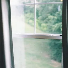 white framed glass window during daytime related to Elevate Your Window Dressing with Curtain Scarves and Valances