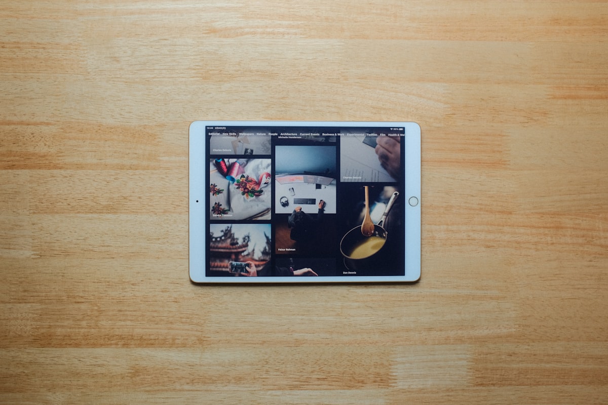 white ipad on brown wooden table related to Maximizing Space and Style with a Coaster Loft Bed