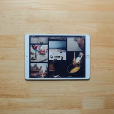 white ipad on brown wooden table related to Maximizing Space and Style with a Coaster Loft Bed