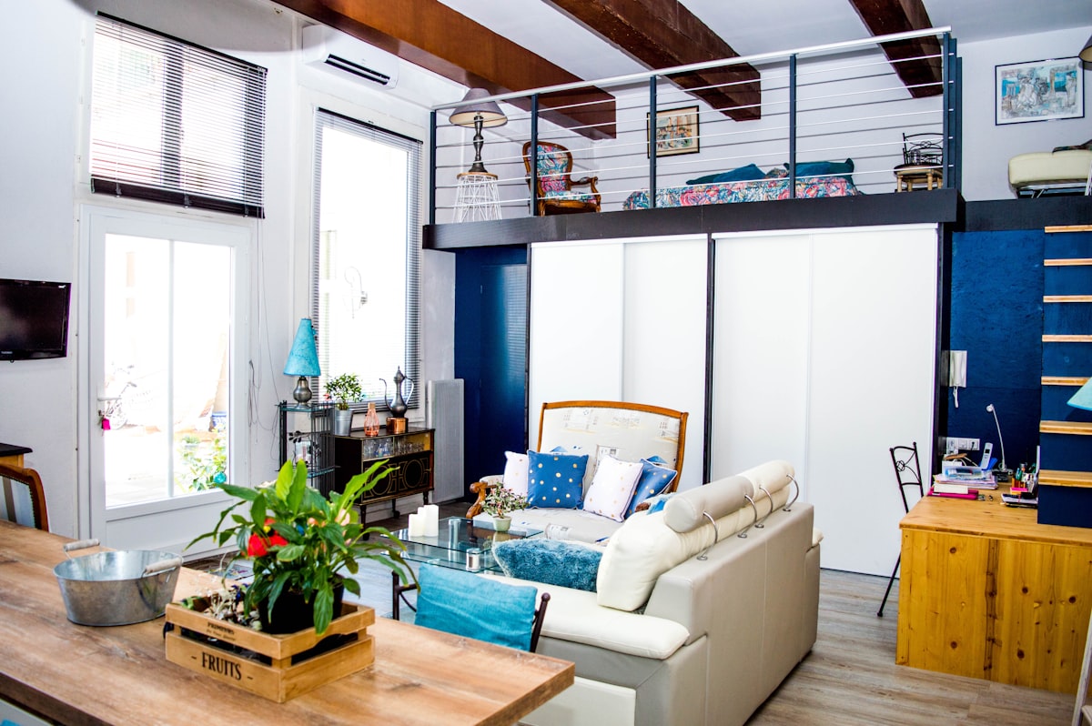 white leather couch and ottoman dinign set related to Maximizing Space with Practical Loft Bed Features