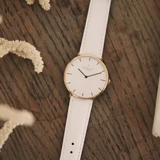 white round analog watch at 10 10 related to Elegant Simplicity: The Timeless Allure of Black and White Kitchen Valances