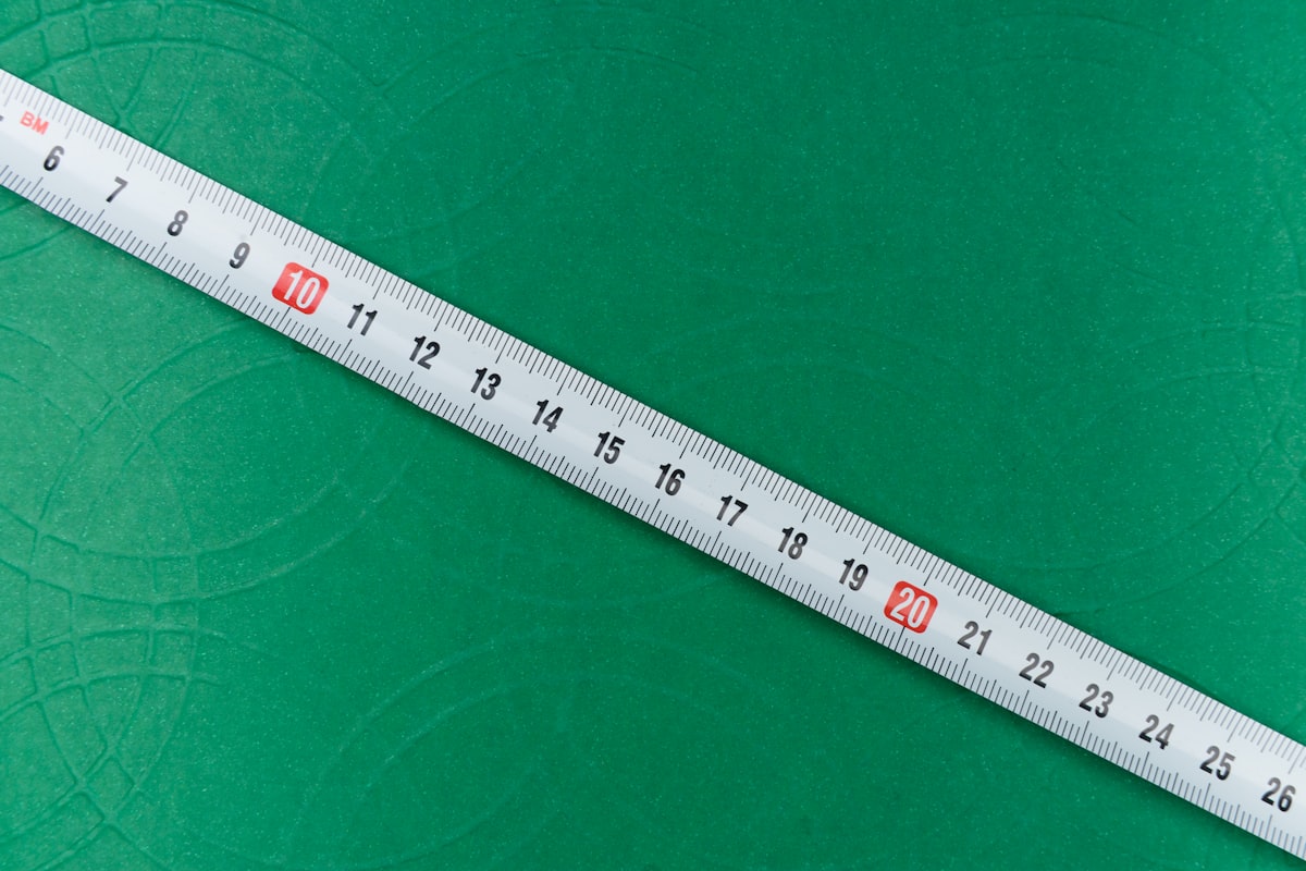 white ruler on green textile related to Understanding Standard Valance Length