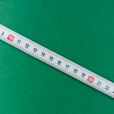 white ruler on green textile related to Understanding Standard Valance Length