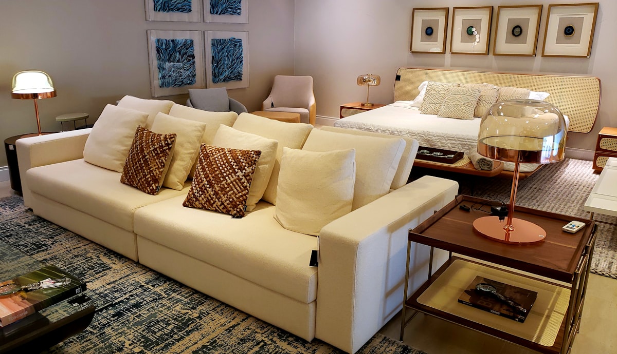 white sofa chair near white table lamp related to Elevate Your Living Space: The Ultimate Guide to Bed Bath and Beyond Sofa Covers