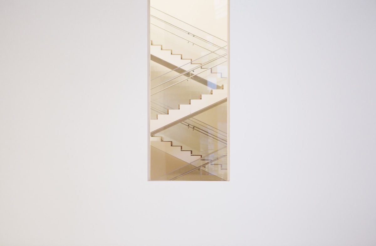 White staircase related to Finding the Perfect Solution: Stairs for Your Pet's Access to High Beds