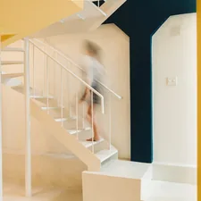 white staircase with blue wooden doors related to Elevate Your Bedroom: White Bunk Beds with Stairs for Kids