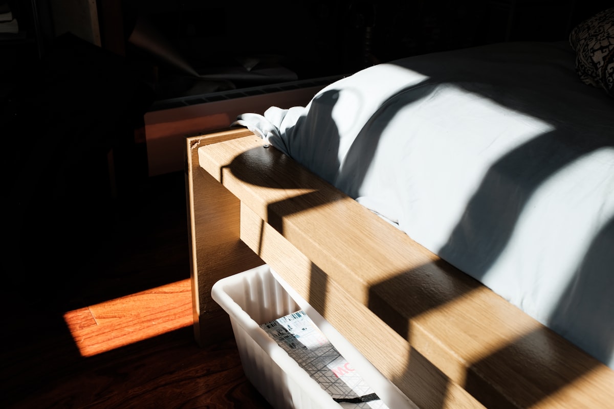 white textile on brown wooden table related to Maximizing Space: Ergonomic Twin Bed with Storage Options