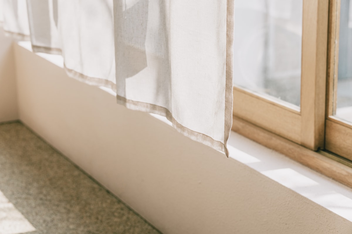white window curtain on window related to Elevate Your Windows: Valances and Cornices