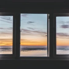 white wooden framed glass window near body of water related to Elevate Your Windows with Beautiful Curtains with Valance