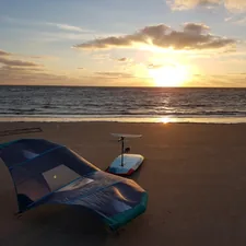 Wingfoil gear in the sunset after a great session.

Visit wingfoil.com for more wing foiling and wing surfing photos and videos. related to Sandy Snooze: The Ultimate Guide to Inflatable Beach Beds