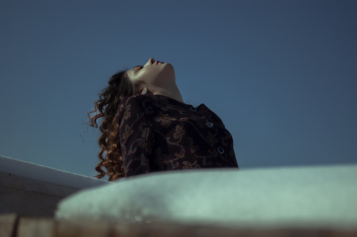 woman in black and brown floral hijab related to The Perfection of Bed Head Foxy Curls