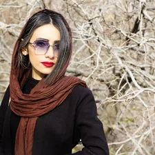 woman in black long sleeved shirt and brown scarf related to Brown Scarf Valance