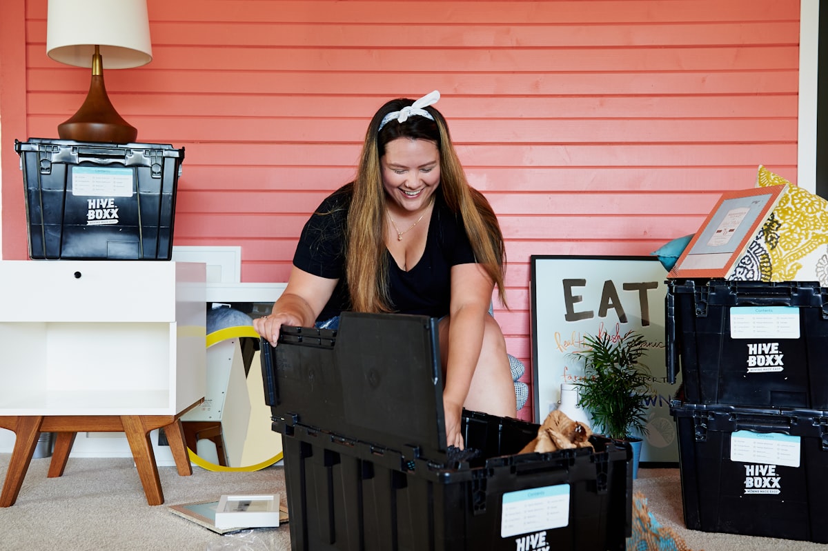 woman in black tank top sitting on black plastic crate related to Exploring the Best Big Lots Furniture Beds for Every Style and Budget