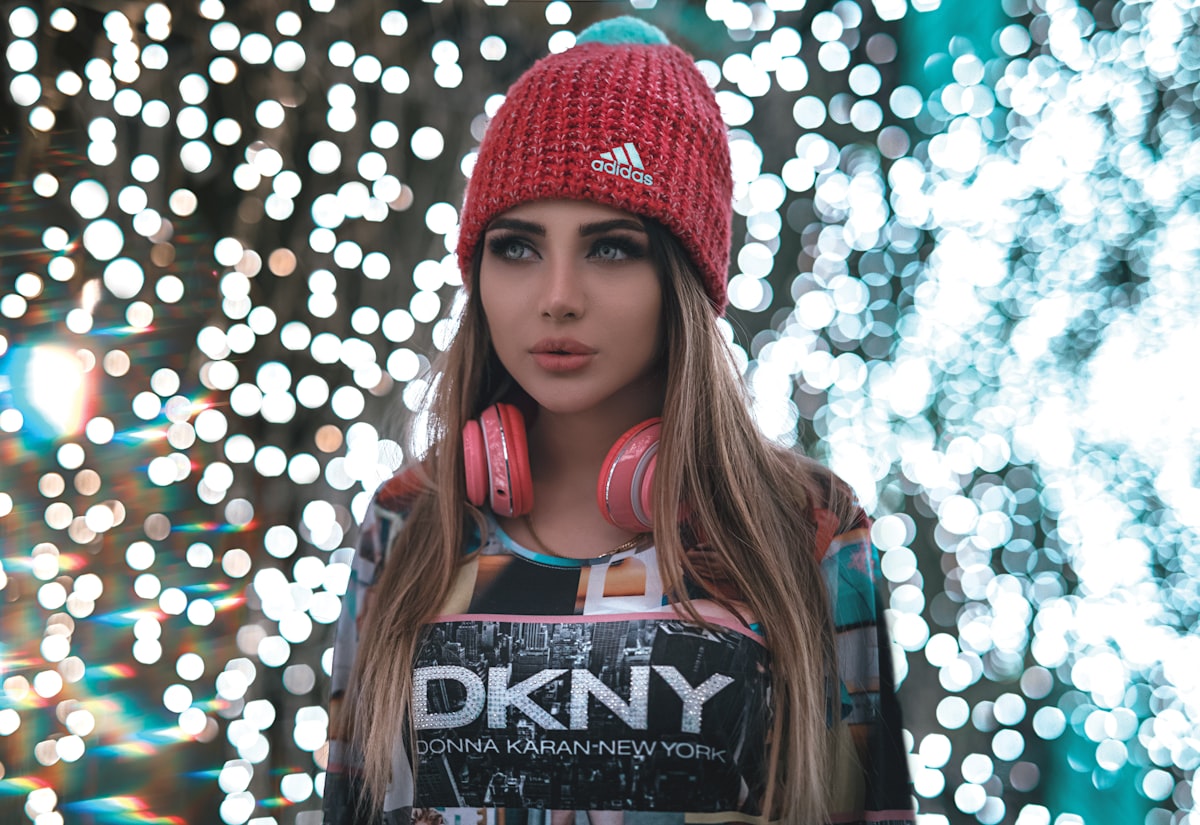woman in red beanie related to Discover the Cozy World of DKNY Coverlets and Quilts