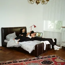 woman lying on black leather bed related to Sleuthing Secrets: Exclusive Insights into Jewish Guys