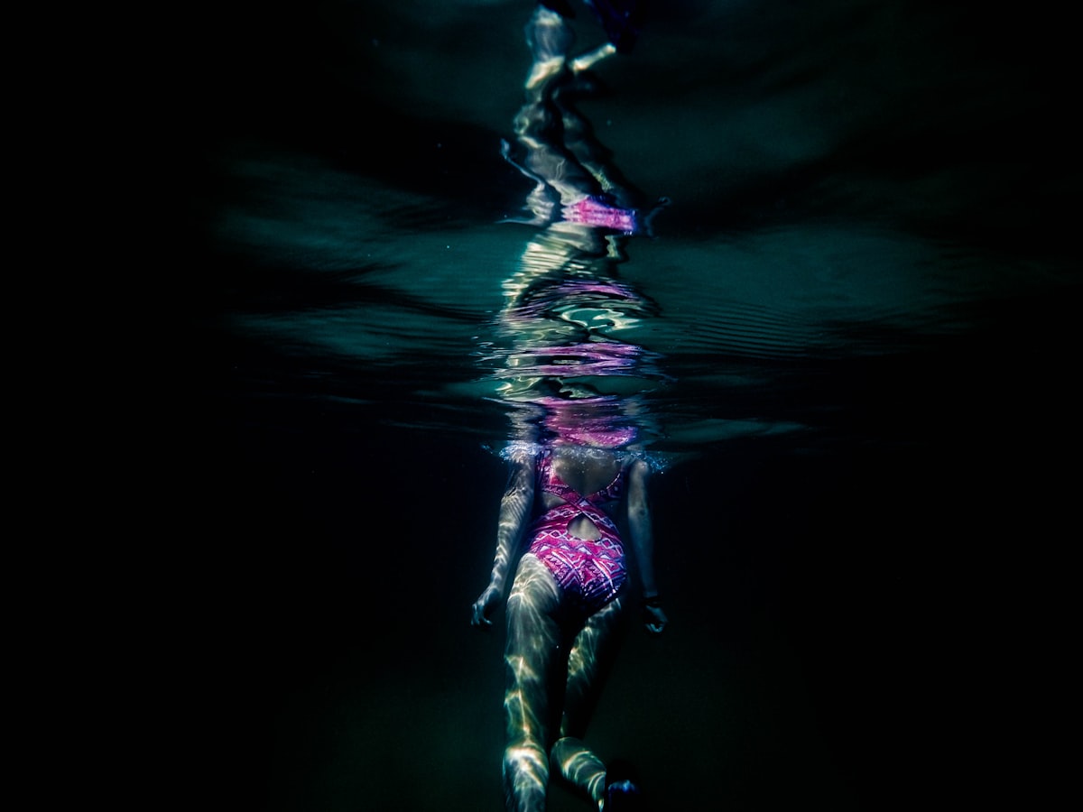 woman under water related to Unveiling the Enchantment: A Deep Dive into the Barbara Barry Cloud Nine Coverlet