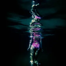woman under water related to Unveiling the Enchantment: A Deep Dive into the Barbara Barry Cloud Nine Coverlet