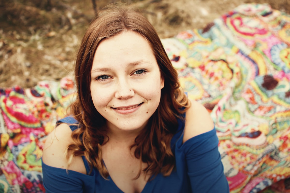 woman wearing blue shirt related to Blue Quilts and Coverlets