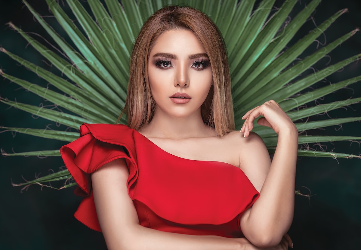 woman wearing red dress related to The Elegance of Pleats: Unlocking the Beauty of Pleated Valance Patterns