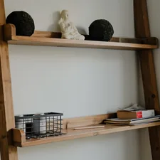 Wooden ladder shelf with decorative items and books. related to Build Your Own DIY Bunk Bed Ladder: A Step-by-Step Guide