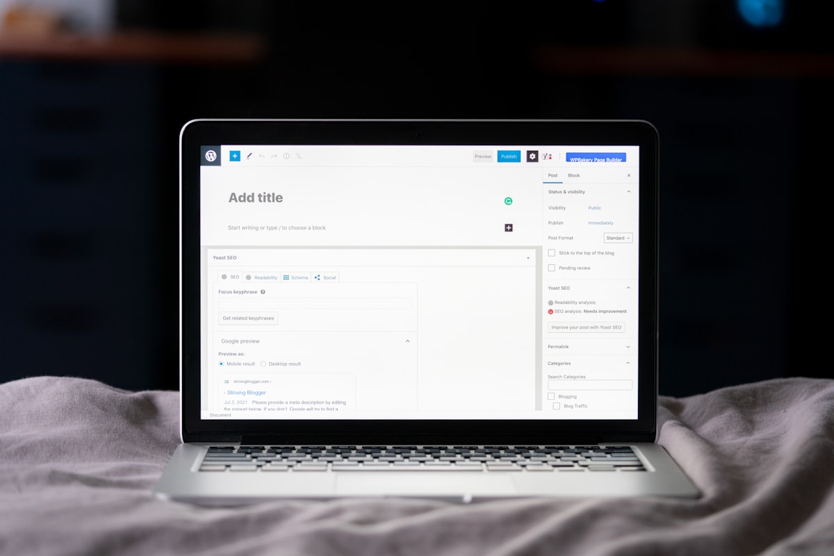 WordPress add a new post screen, with a laptop on the bed.  related to Bed Bug Bites Back: The Rise of an Urban Nightmare